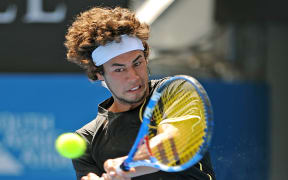 Australian tennis player Nick Lindahl plays a backhand return against Marcus Baghdatis of Cyprus at the Sydney International on January 11, 2010. Baghdatis won is straight sets 6-2, 7-5. AFP PHOTO / Greg WOOD