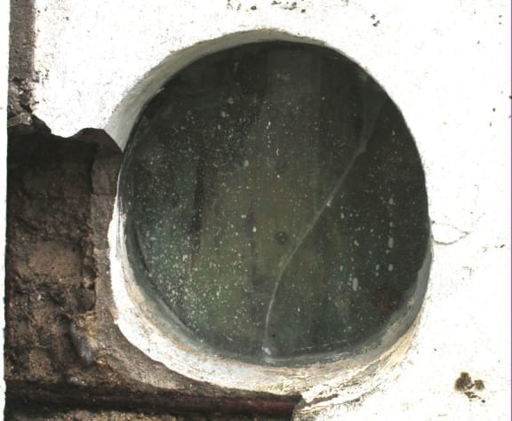 This is  an image of Porthole glass  built into bach chimney