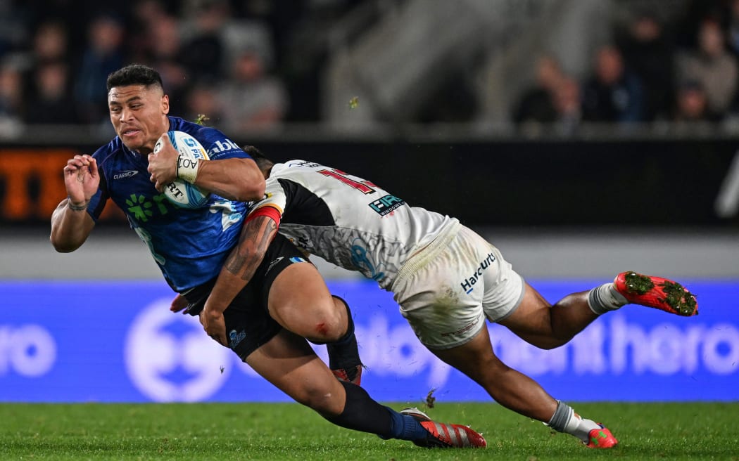 Caleb Clarke is tackled.