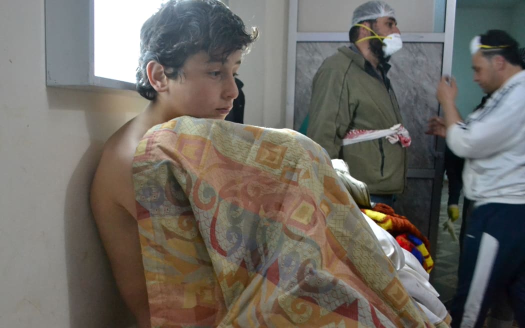 A young man at a clinic in the village of Sarmin following reports of suffocation cases related to an alleged regime gas attack in the area.