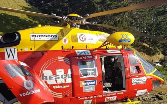 The Westpac rescue helicopter at the scene of the crash on Monday.