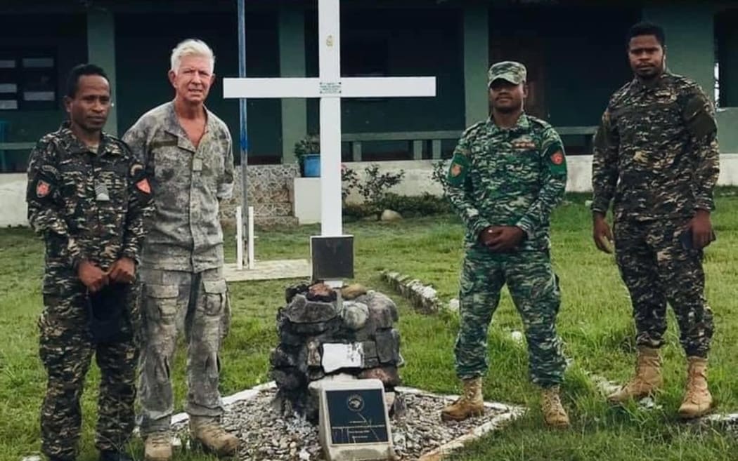 Lieutenant Colonel Martin Dransfield (second left) and members of the Timorese Defence Force at Tilomar Base Memorial Cross.
