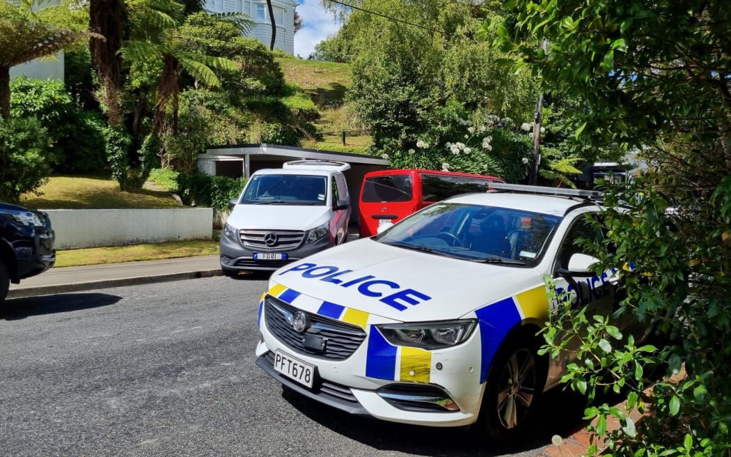 A police car and other cars on Baroda Street.