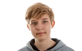 A closeup photo of transgender boy with slightly different background