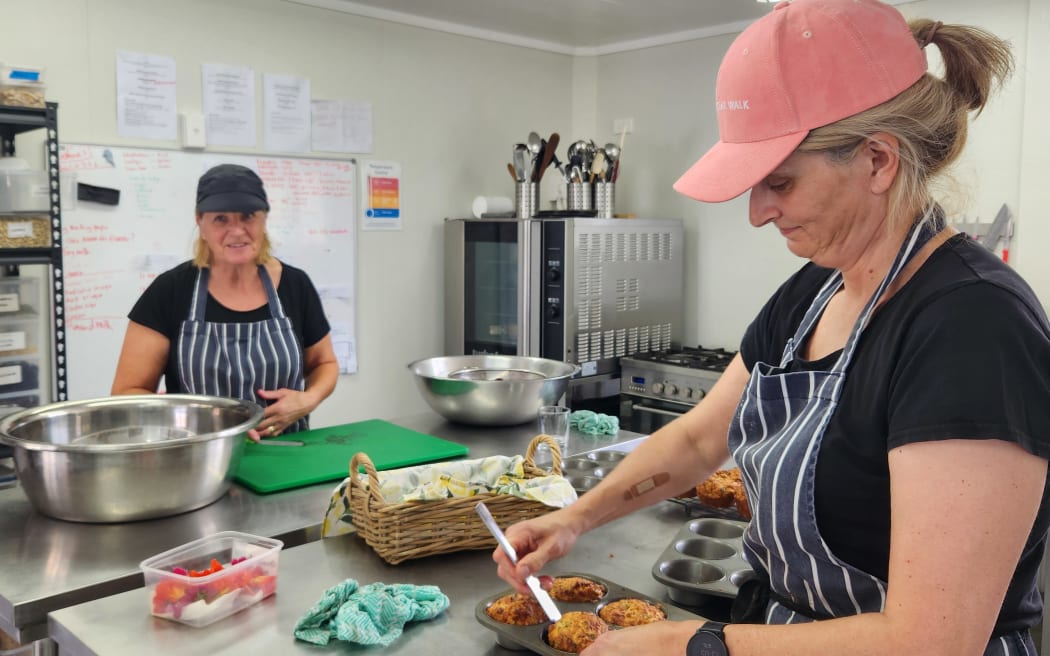 Justine Dunshea and Susie Fisher prepare meals for 45 hikers daily