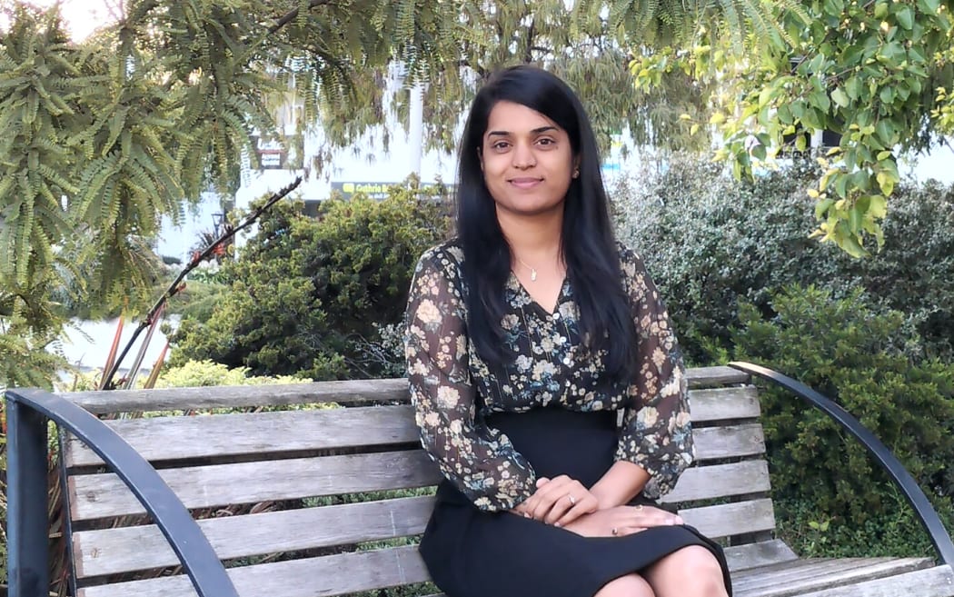 Praj Narkhede sitting on a park bench in Timaru.