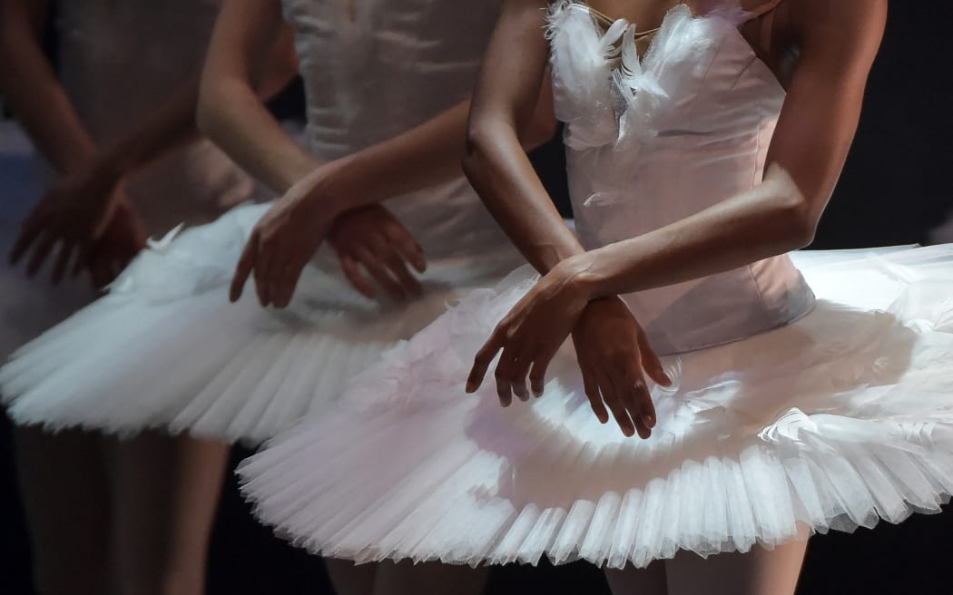 Dancers of the Aalto Ballett Essen perform "Swan Lakein Seville, on January, 2022. (Photo by CRISTINA QUICLER / AFP)