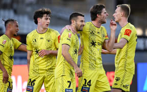 Wellington player Kosta Barbarouses and team celebrate his goal during the Wellington Phoenix v Sydney FC A-League match.
