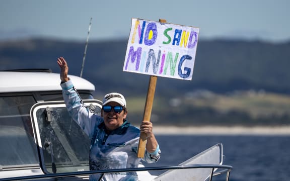 A flotilla of more than 50 watercraft converged from Whangārei Heads to Langs Beach to oppose the proposal to dredge nearly 8.5 million cubic meters of sand over the next 35 years.