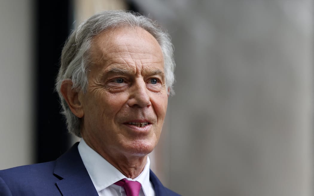 Former British Prime Minister Tony Blair, wearing a face covering due to Covid-19, leaves the BBC in central London on June 6, 2021, after appearing on the BBC political programme The Andrew Marr Show.