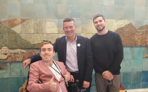 Joshua Perry, National list MP Michael Woodhouse and Mr Perry's carer Tim Marshall.