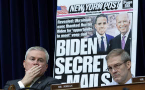 With a poster of a New York Post front page story about Hunter Biden’s emails on display, Committee Chairman James Comer and fellow Republican Jim Jordon listen during a hearing before the House Oversight and Accountability Committee at Rayburn House Office Building on Capitol Hill.