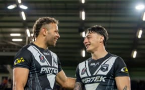 New Zealand's Sebastian Kris with Charnze Nicoll-Klokstad.