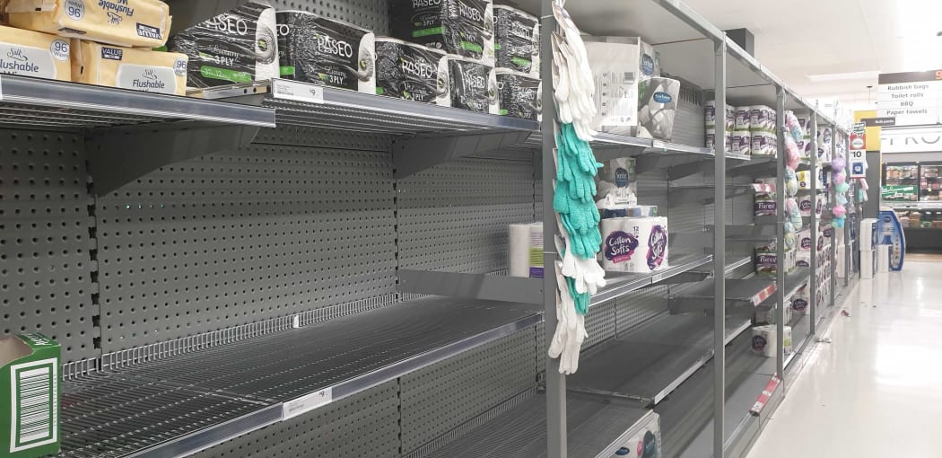 Shelves at Countdown, St Lukes, Auckland, were stripped of toilet paper following the announcement the country will move to red.