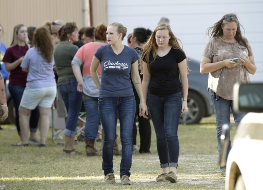 People gather near First Baptist Church.