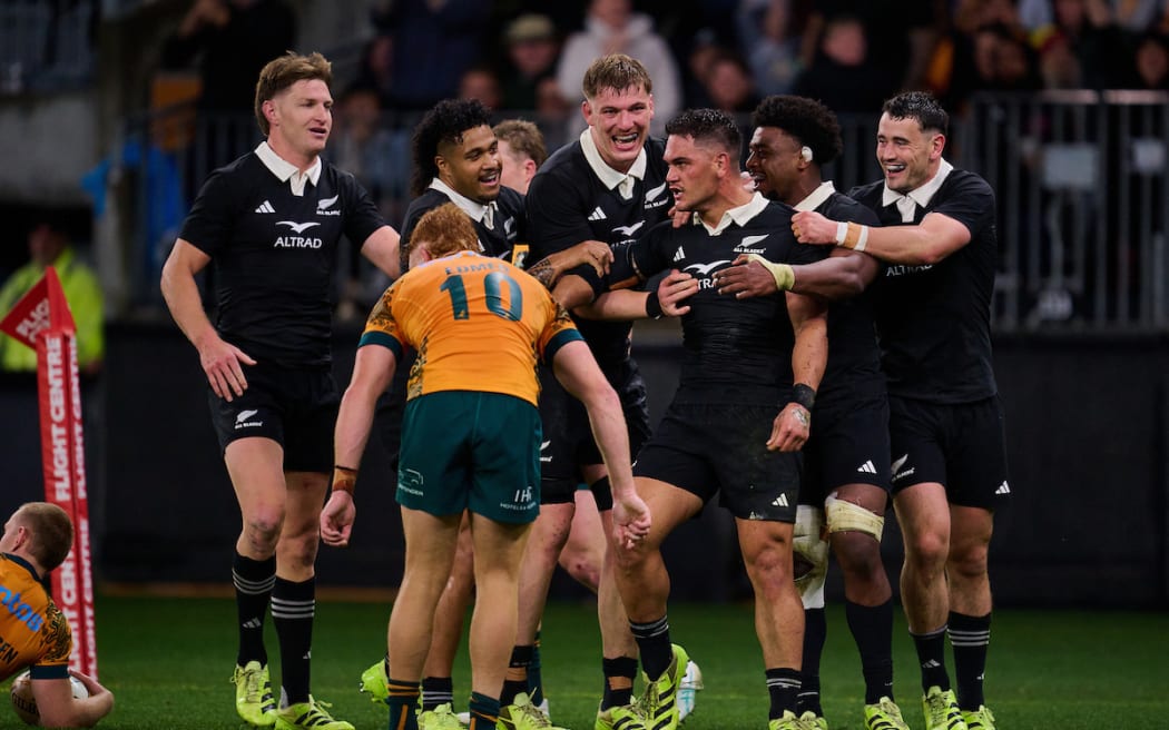 Quinn Tupaea celebrates a try.