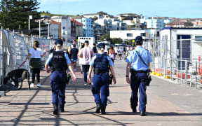 Police patrol near Bondi Beach in Sydney after an extension of the lockdown was announced yesterday.