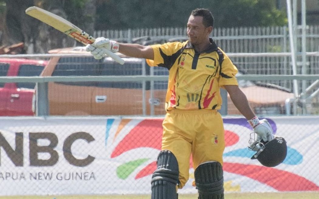 PNG opener Vani Morea reaches his century against Kenya.