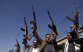 Yemen's Houthi loyalists chant slogans during a tribal gathering in Sana'a on February 20, 2020.