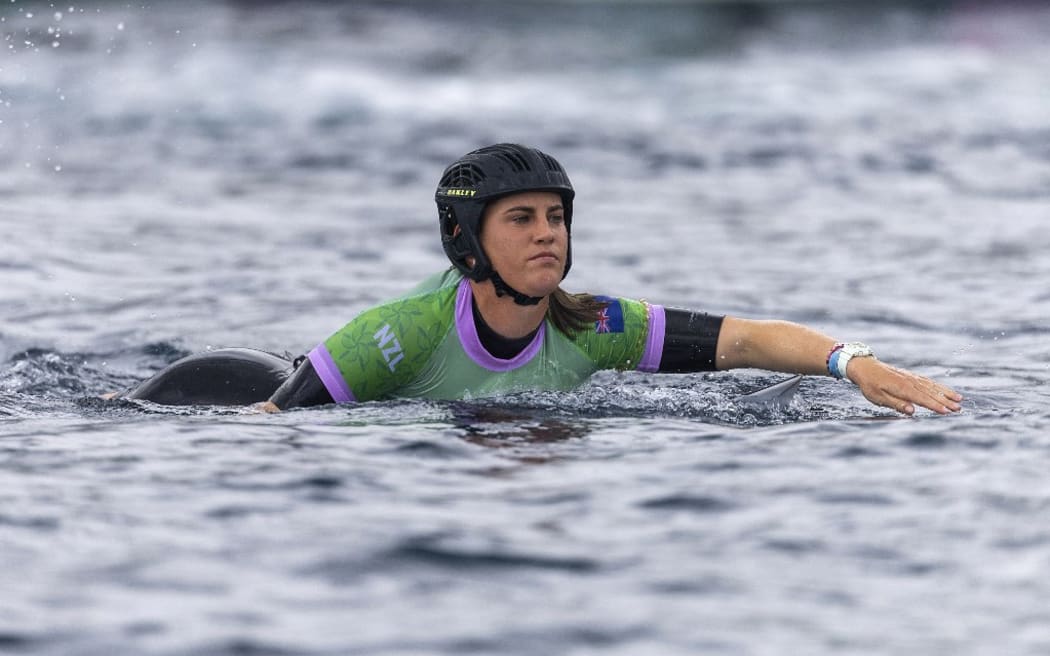 Saffi Vette of Team New Zealand paddles during round one of surfing during the Paris 2024 Olympic Games on July 27, 2024 in Teahupo'o, French Polynesia. (Photo by Ed Sloane / POOL / AFP)