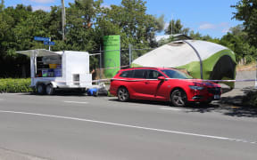 Police at the scene of a sudden death in an empty industrial lot in Hastings today.