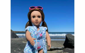 Lynn Jarvis is creating hand-made dolls clothes, and doing photoshoots around Wellington to keep in touch with her granddaughter Alyssa.