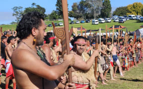 Members of Te Aka Rauwhero welcome Government representatives to Ōrākau.