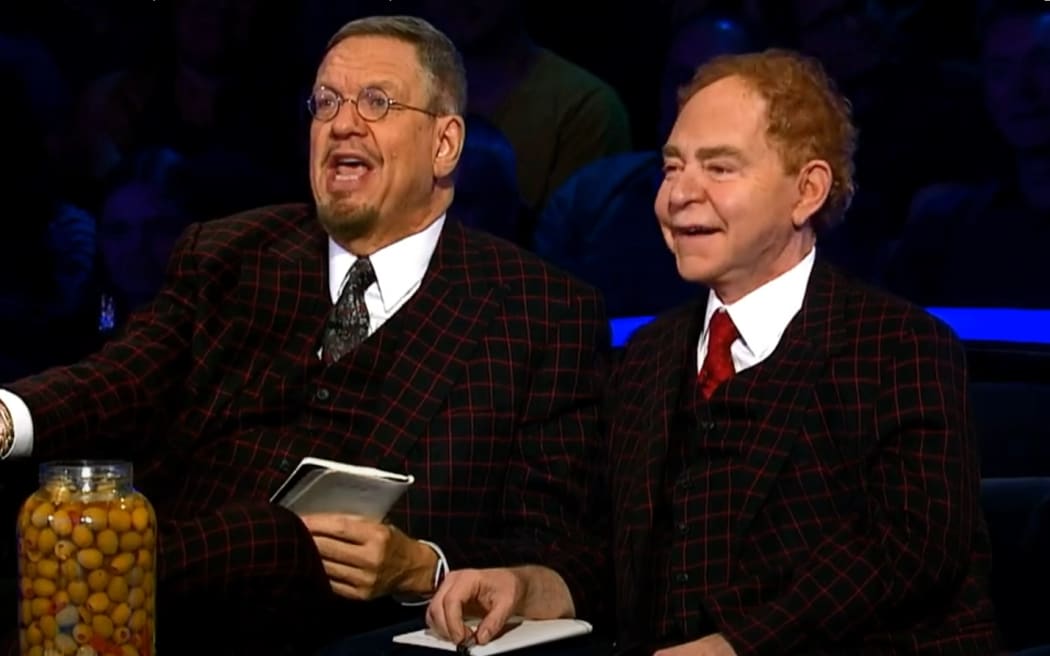 US performers Penn & Teller - Penn Jillette (left) and Raymond Teller, speaking to Kiwi performance trio Laser Kiwi as part of the television show Penn & Teller: Fool Us.