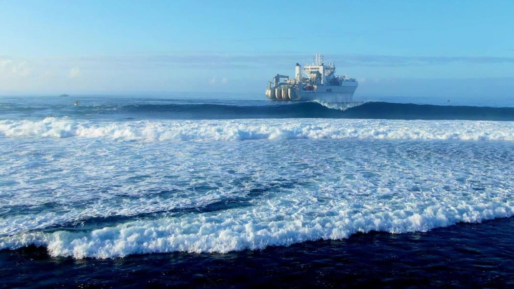 Cable laying vessel, SubCom Reliance, in position off Rutaki passage, Rarotonga, Cook Islands before commencing the shore landing of the Manatua One Polynesia fibreoptic cable.