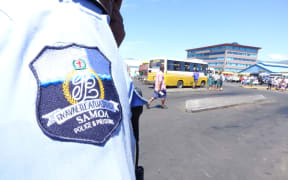 Samoa police badge bearing the country's public seal which reads "Faavae i Le Atua Samoa" which translates to English as "God be the Foundation of Samoa"