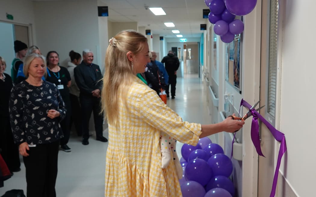 Whangārei mum Ashlee Robinson, the first donor, cuts the ribbon to open Northland’s first human milk bank.