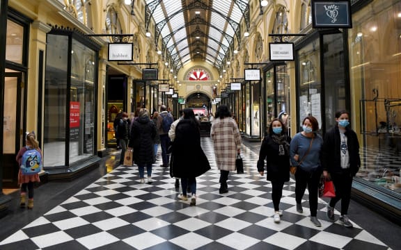 Shoppers return to the central business district in Melbourne on July 7, 2021, after the city announced an easing of Covid restrictions.