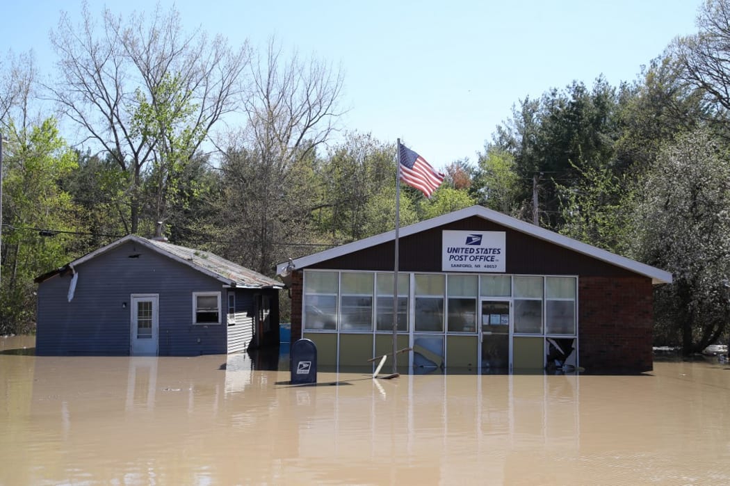 SANFORD, MICHIGAN - MAY 20: Main street is flooded after water from the Tittabawassee River breached a nearby dam on May 20, 2020 in Sanford, Michigan.