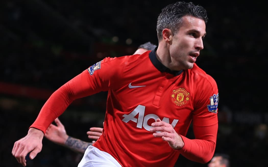 Robin van Persie of Man Utd peels away as he celebrates after scoring.