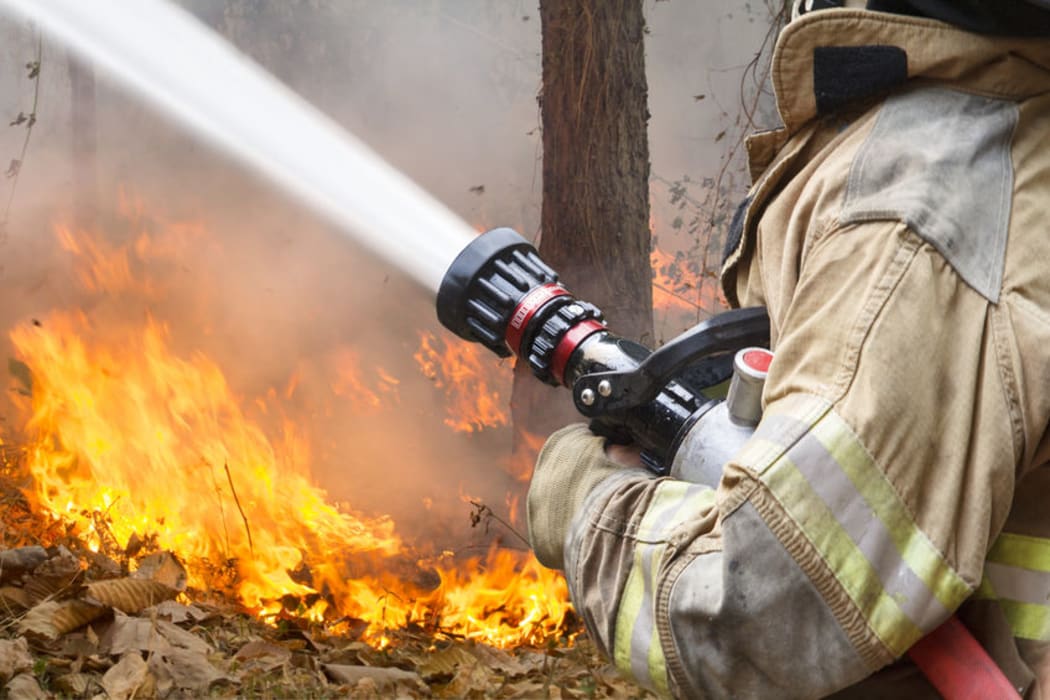 firefighter with hose