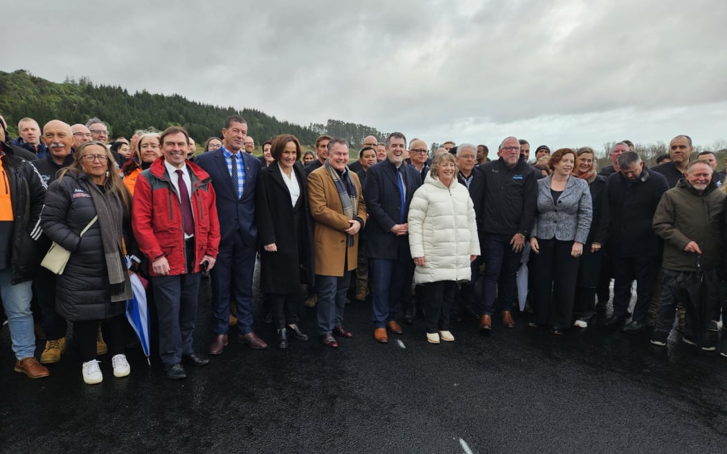 Stakeholders for the new highway pose for a photo after the cutting of the ribbon.