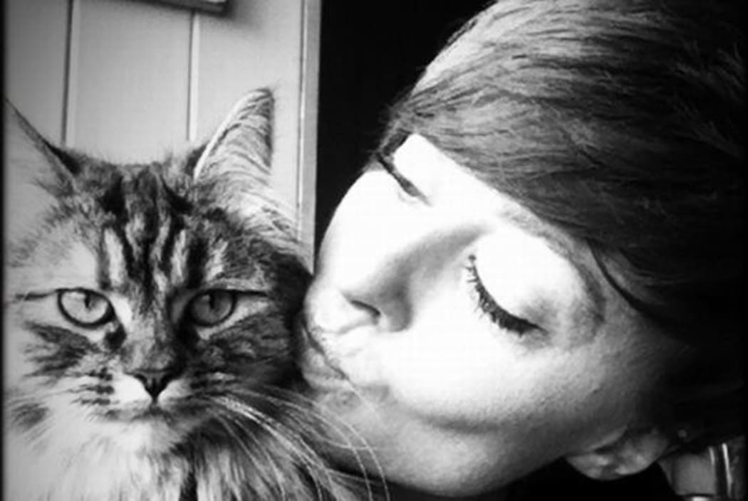 Sophie Roberts kissing her cat