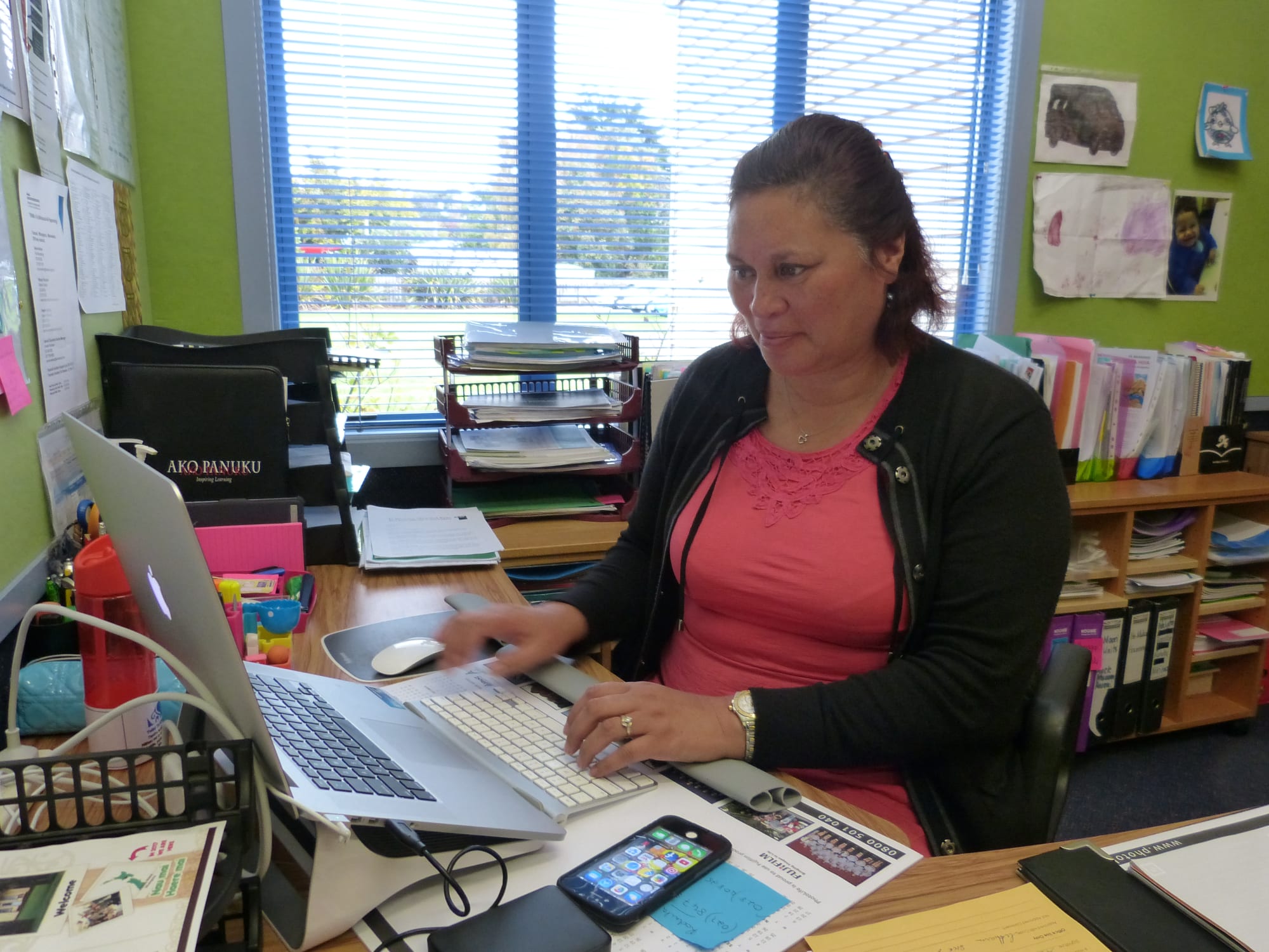 Principal Te Kura Kaupapa Maori o Te Atihaunui-a-Paparangi Miriama Harmer at her desk in her office