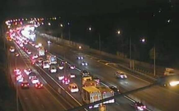 A screenshot from a NZTA traffic cam shows vehicles backing up towards Greenlane.