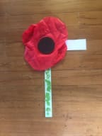 A poppy made from a red New World bag by Mei Smith, 6