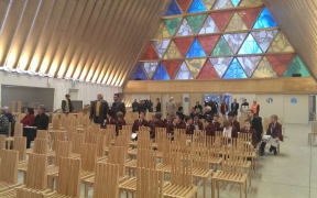 The Trinity Window above the entrance to the cardboard cathedral.