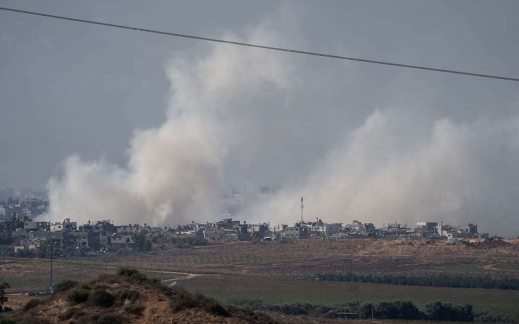 11/15/2023 Beeri, Israel. In this photograph taken near the Israeli border with the Gaza Strip a large plume of smoke rises over over Beit Hanoun in Northern Gaza after an Israeli air strike is seen, on November 16, 2023 from Sedorot, Israel. More than a month after Hamas's Oct. 7 attacks, the country's military has continued its sustained bombardment of the Gaza Strip and launched a ground invasion to vanquish the militant group that governs the Palestinian territory. (Photo by Dima Vazinovich / Middle East Images / Middle East Images via AFP)