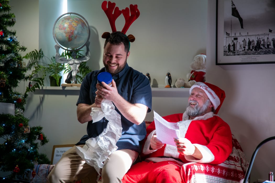 Staff celebrating Christmas at Antarctica's Scott Base share Secret Santa gifts.
