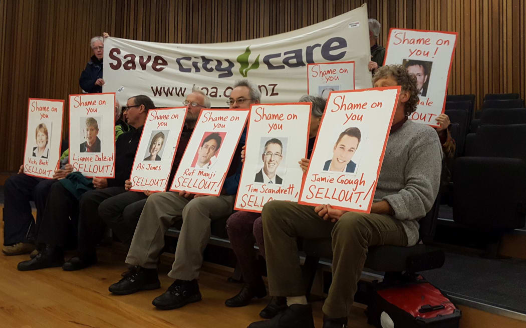 A small group protested planned asset sales by the Christchurch City Council at its meeting today.