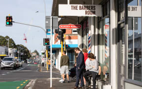 A queue outside The Barbers Room on Dominion Rd, Mt Eden, 14 May. NZ is in level 2 after seven weeks of lockdown restrictions.