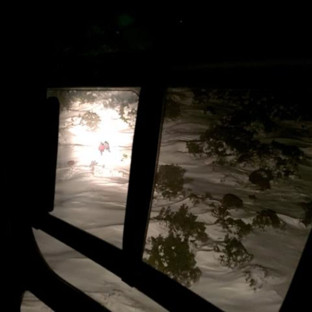 The woman was spotted down a steep gully far below the ski field.