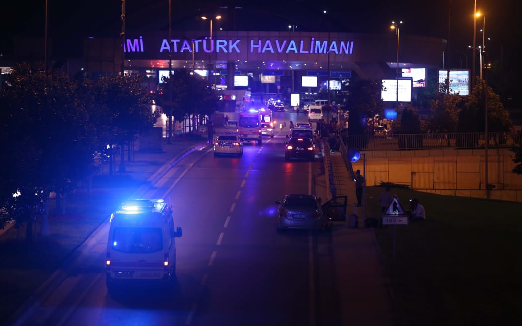 Police block the roadway to a terminal at Ataturk Airport.