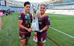 Kimiora Nati and Ngatokotoru Arakua with the Holden Premiership Trophy after the Broncos beat the Roosters.