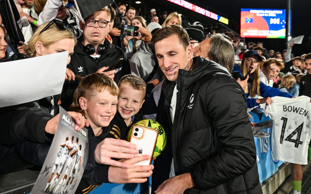 Young fans and supporters take a selfie with New Zealand captain Chris Wood.
New Zealand All Whites v Samoa, FIFA World Cup 2026 Oceania Qualifier football match at Go Media Stadium, Auckland, New Zealand on Monday 18 2024. © Photo: Andrew Cornaga / Photosport