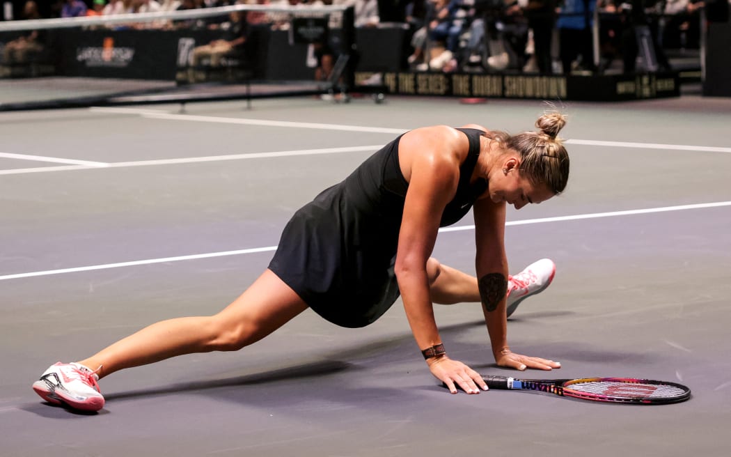 Belarus’ Aryna Sabalenka reacts as she plays against Australia's Nick Kyrgios during the Battle of the Sexes exhibition tennis match in Dubai, 2025.